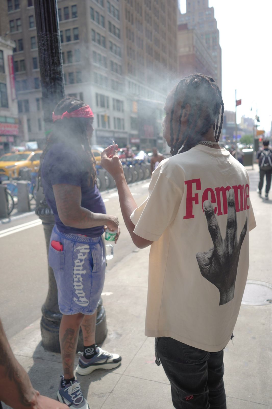 TorchBinFinessin on a Manhattan sidewalk in a Femme tee
